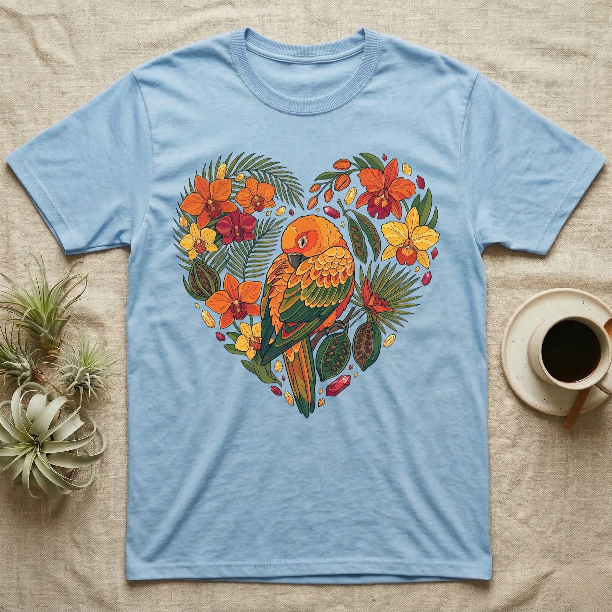 Light blue t-shirt with a heart-shaped tropical bird and floral design.
