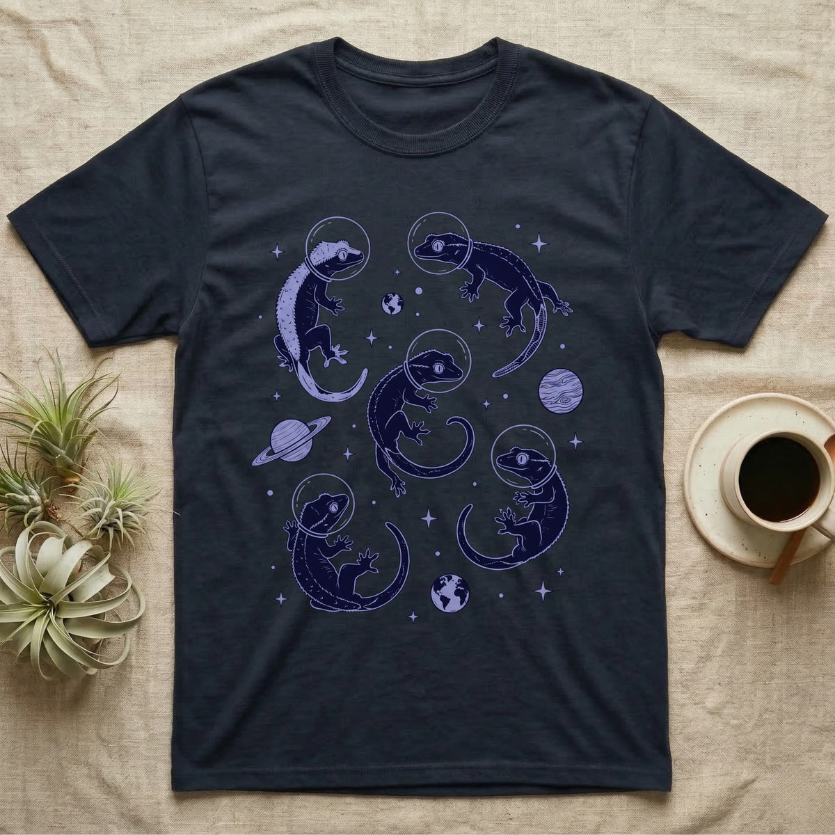 Crested Gecko Cosmic T-Shirt in Navy — Vintage screen-print illustration of crested geckos in astronaut helmets floating in space, deep cosmic indigo monochromatic on dark background.