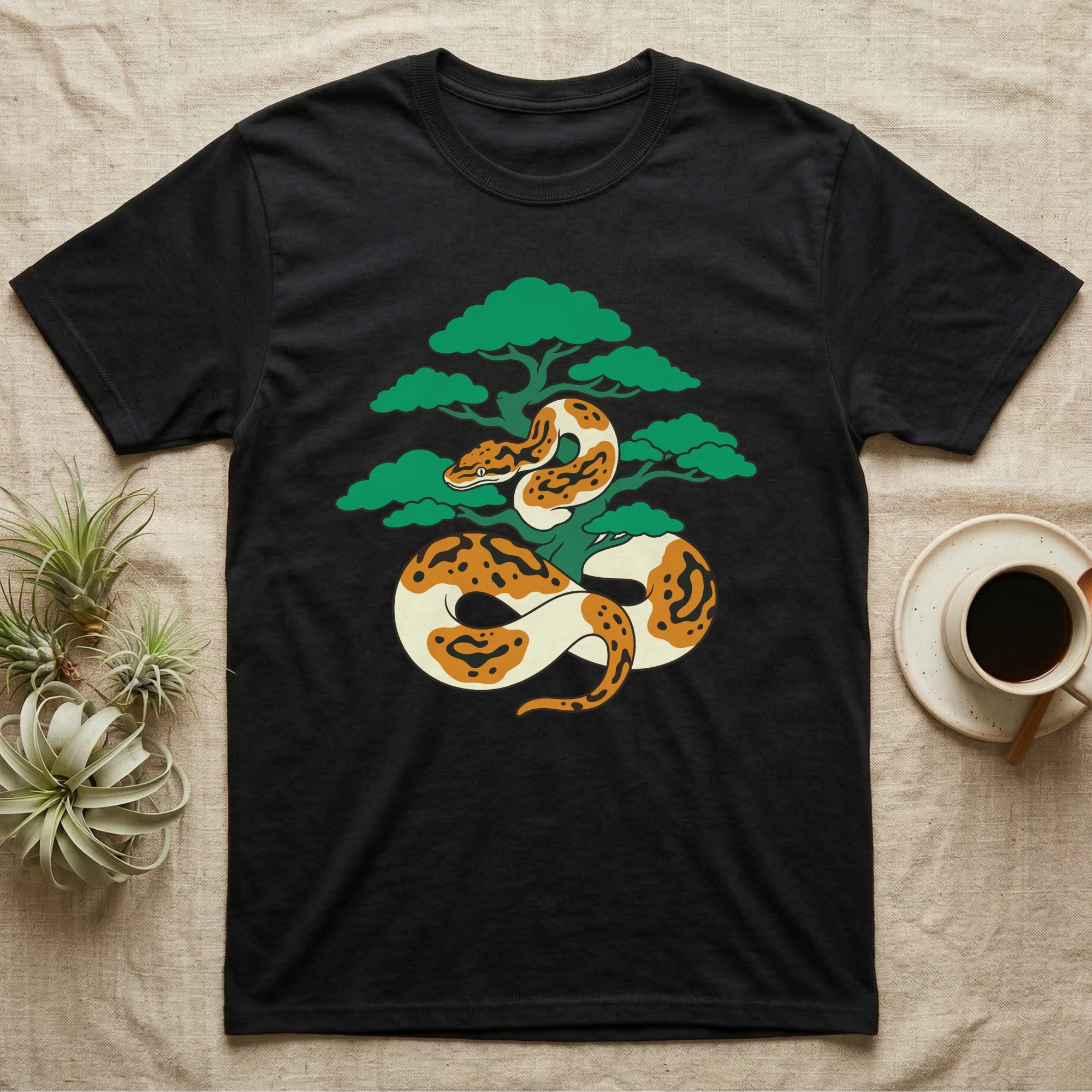 Black t-shirt with a stylized python wrapped around a bonsai tree.
