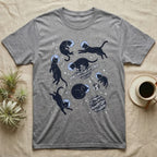 Gray t-shirt with black cats floating in space with planets and stars.