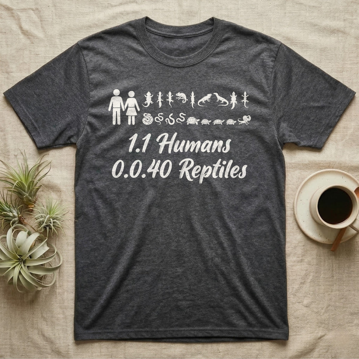 Reptile Family Decal T-Shirt in Dark Heather — Stick-figure family decal of two humans beside two rows of reptile stickers, over script reading 1.1 Humans 0.0.40 Reptiles