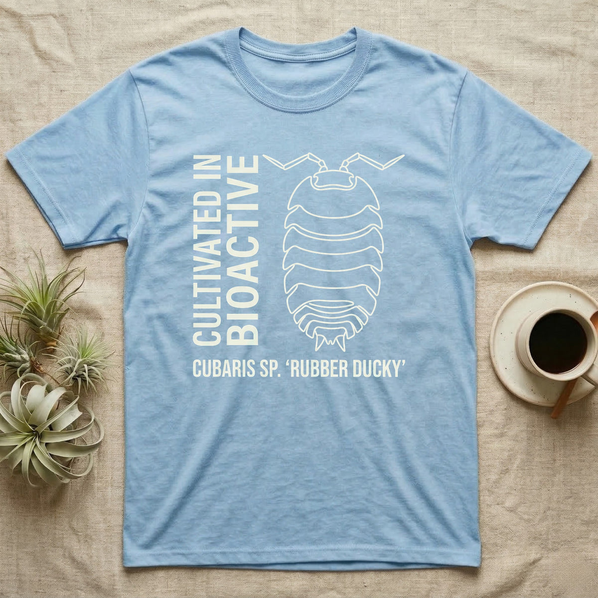 Rubber Ducky Isopod Line Art T-Shirt in Light Blue — Bone-white outline drawing of a rubber ducky isopod labelled Cubaris sp. beside vertical stencil type.