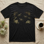 Red-Eared Slider Pond T-Shirt in Black — Painted 90s wildlife art of three red-eared sliders swimming a dark pond with golden ripples, water-lilies and cattails
