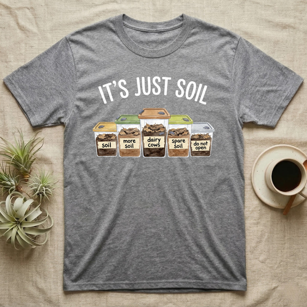 Isopod Soil Bins T-Shirt in Sport Grey — Watercolour row of five labelled bins of soil with isopods on the lids under the words IT'S JUST SOIL