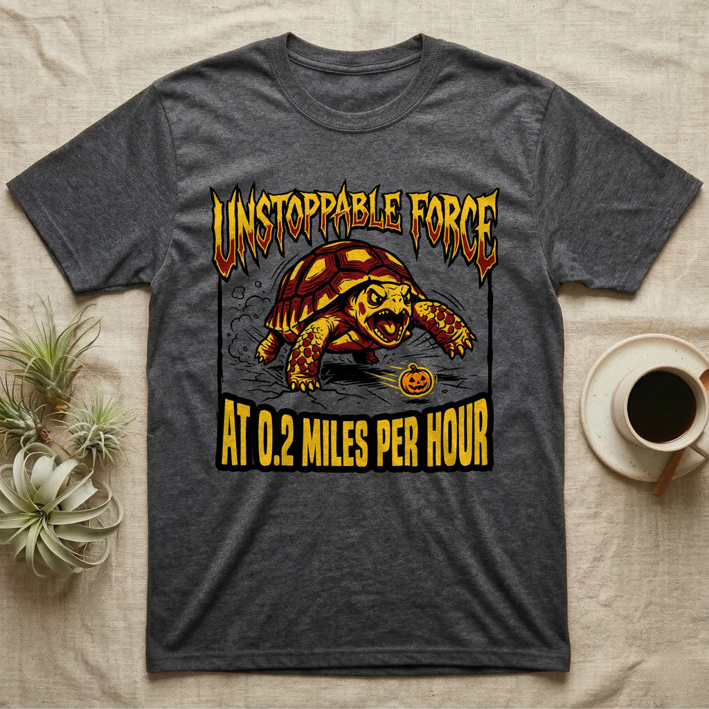 Red-Footed Tortoise Unstoppable Force T-Shirt in Dark Heather — Metal-style furious tortoise charging a candy pumpkin, "Unstoppable Force At 0.2 Miles Per Hour."