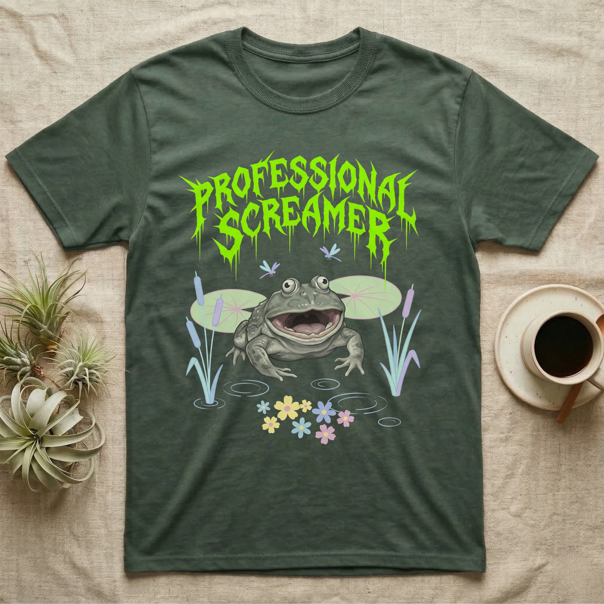 Budgett's Frog Feral T-Shirt in Military Green — Budgett's frog with wide screaming mouth under jagged acid-green metal text PROFESSIONAL SCREAMER with lily pads