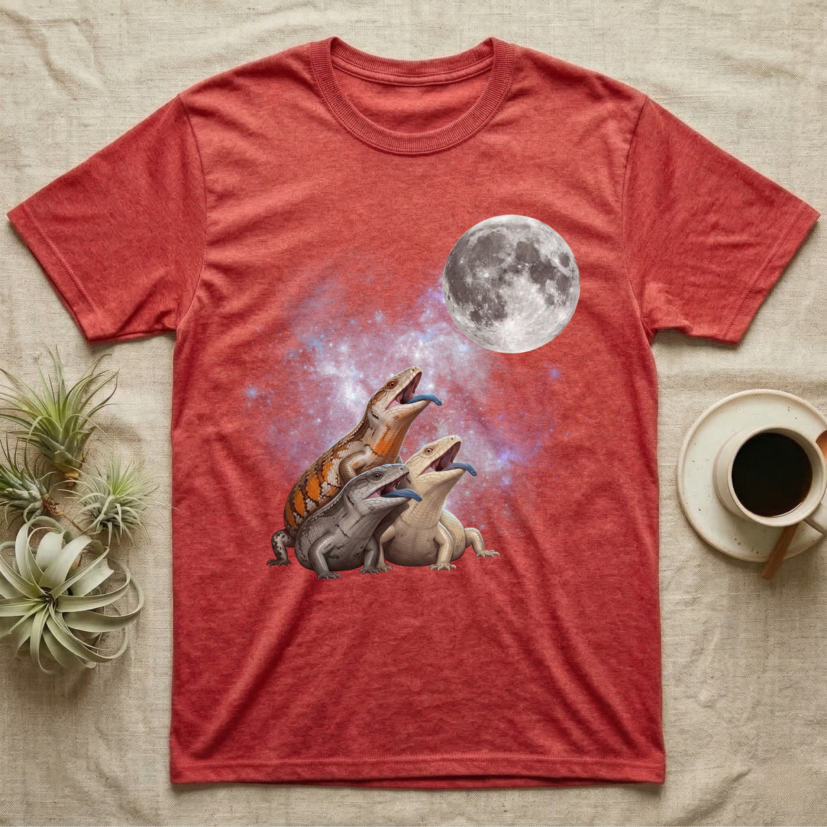 Blue-Tongued Skink Moon Howl T-Shirt in Heather Red — Three Blue-Tongued Skink colour morphs howling at a full moon over a nebula on a dark grey t-shirt.