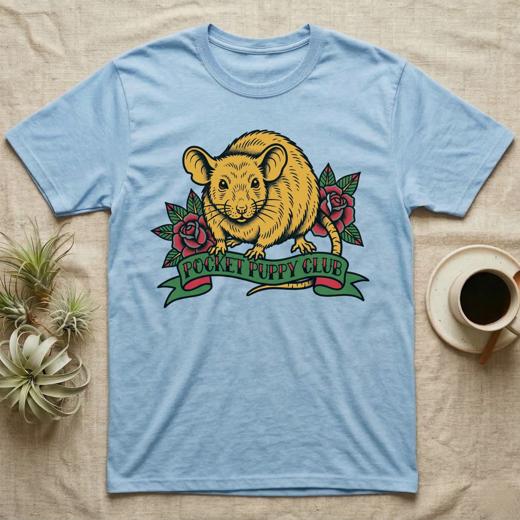 Light blue t-shirt with "Pocket Puppy Club" text on a banner and a rat illustration.