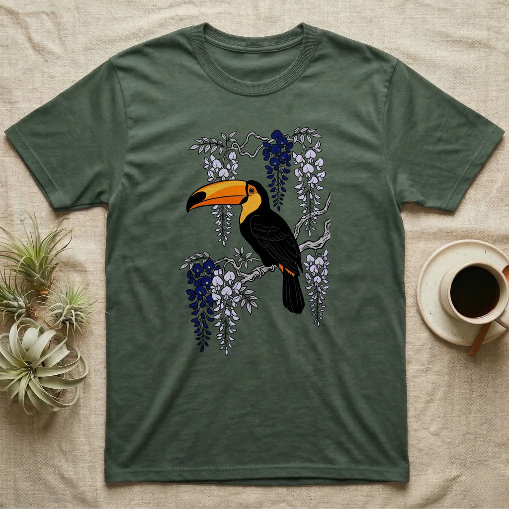 Green t-shirt with a toucan on a branch with purple wisteria.