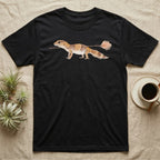 African Fat-Tailed Gecko Watercolour T-Shirt in Black — Watercolour African fat-tailed gecko in profile beneath a thin twig ending in a soft bloom, drawn with a broken ink line.