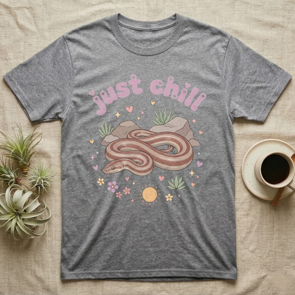 Rosy Boa Softie T-Shirt in Sport Grey — Relaxed coiled rosy boa with sleepy eyes under pastel bubble text "just chill" with tiny hearts.