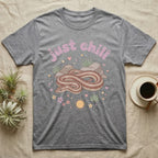 Rosy Boa Softie T-Shirt in Sport Grey — Relaxed coiled rosy boa with sleepy eyes under pastel bubble text "just chill" with tiny hearts.