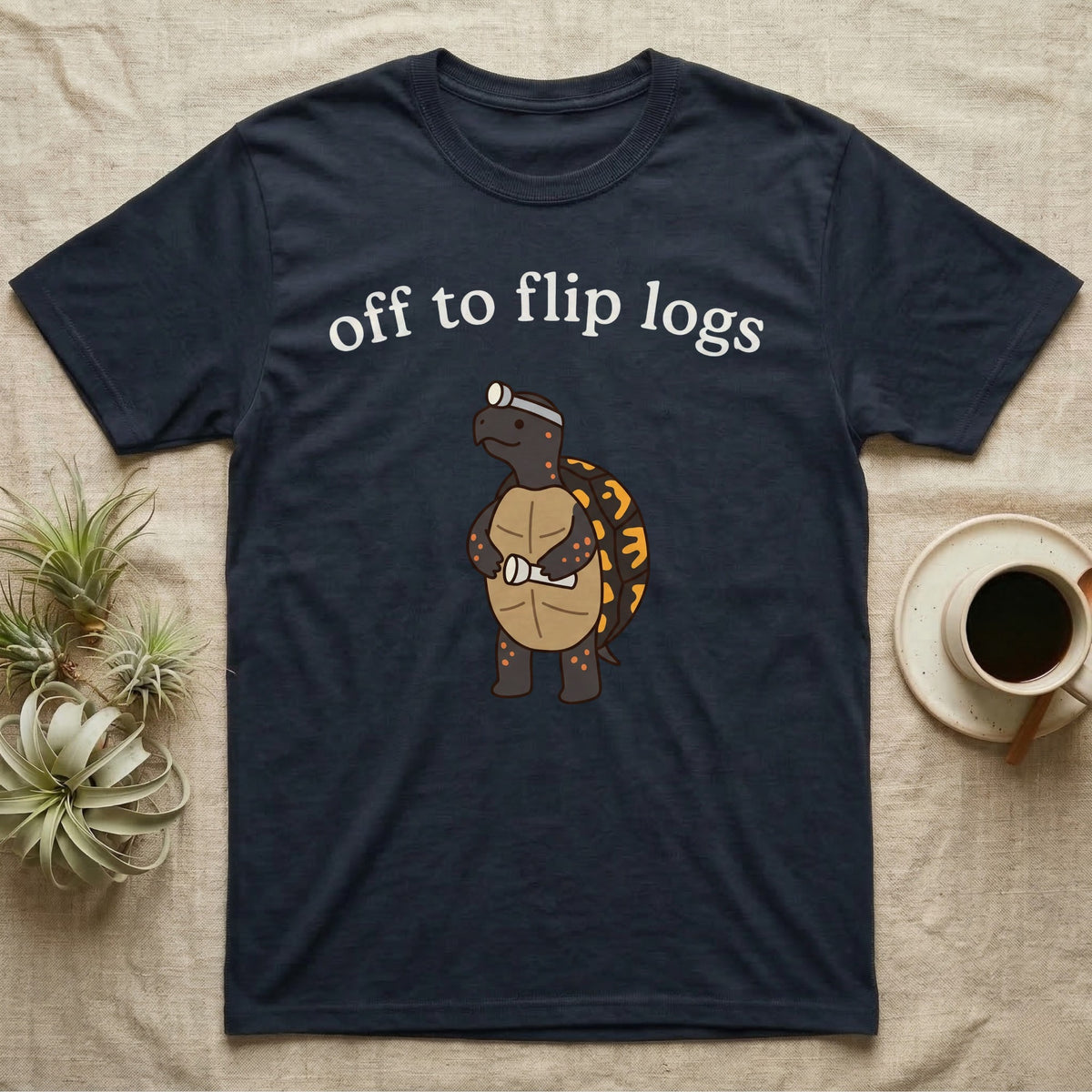 Box Turtle Herping T-Shirt in Navy — Minimal doodle of an eastern box turtle standing upright in a headlamp holding a flashlight, under the words off to flip logs