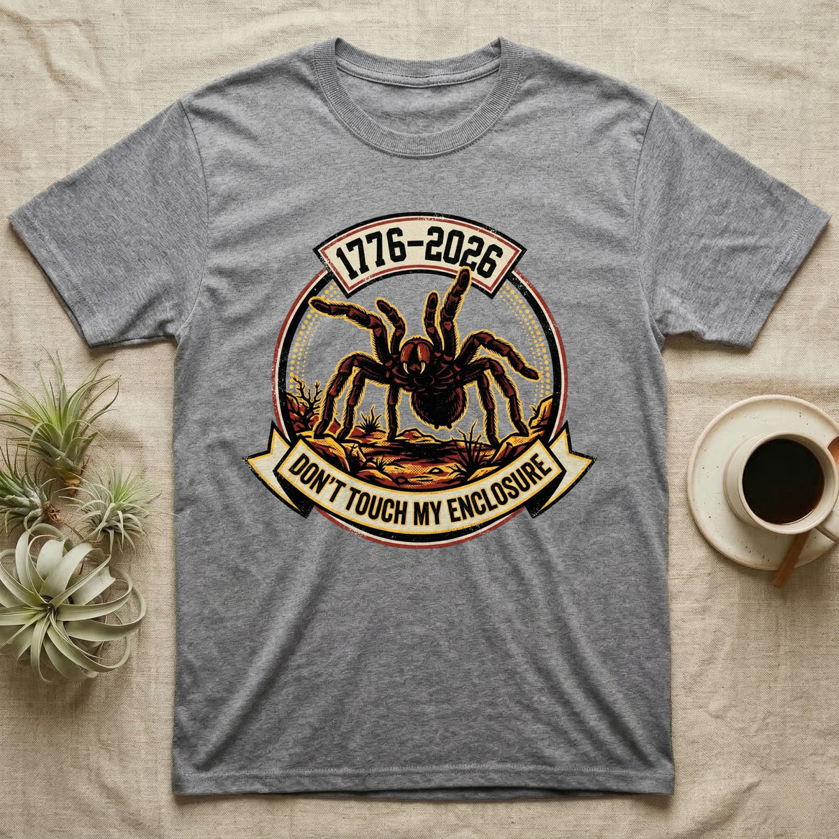 Tarantula Don't Touch Enclosure Tee in Sport Grey — Distressed circular badge of a defensive tarantula on desert ground, red and gold banner reading Don't Touch My Enclosure, on black.
