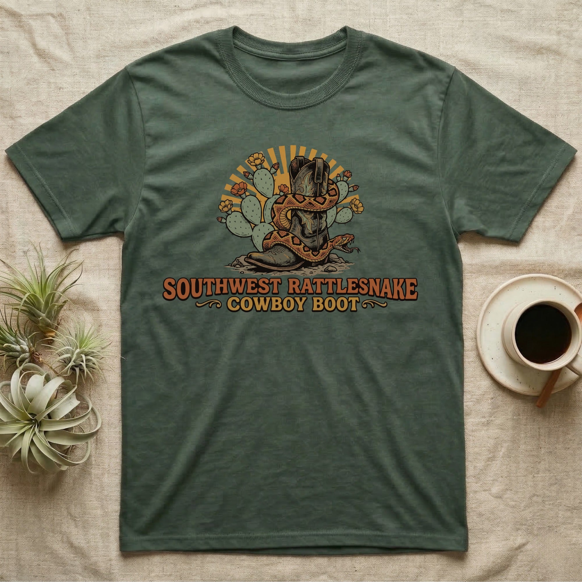 Green t-shirt with "Southwest Rattlesnake Cowboy Boot" text and a snake coiled around a boot.