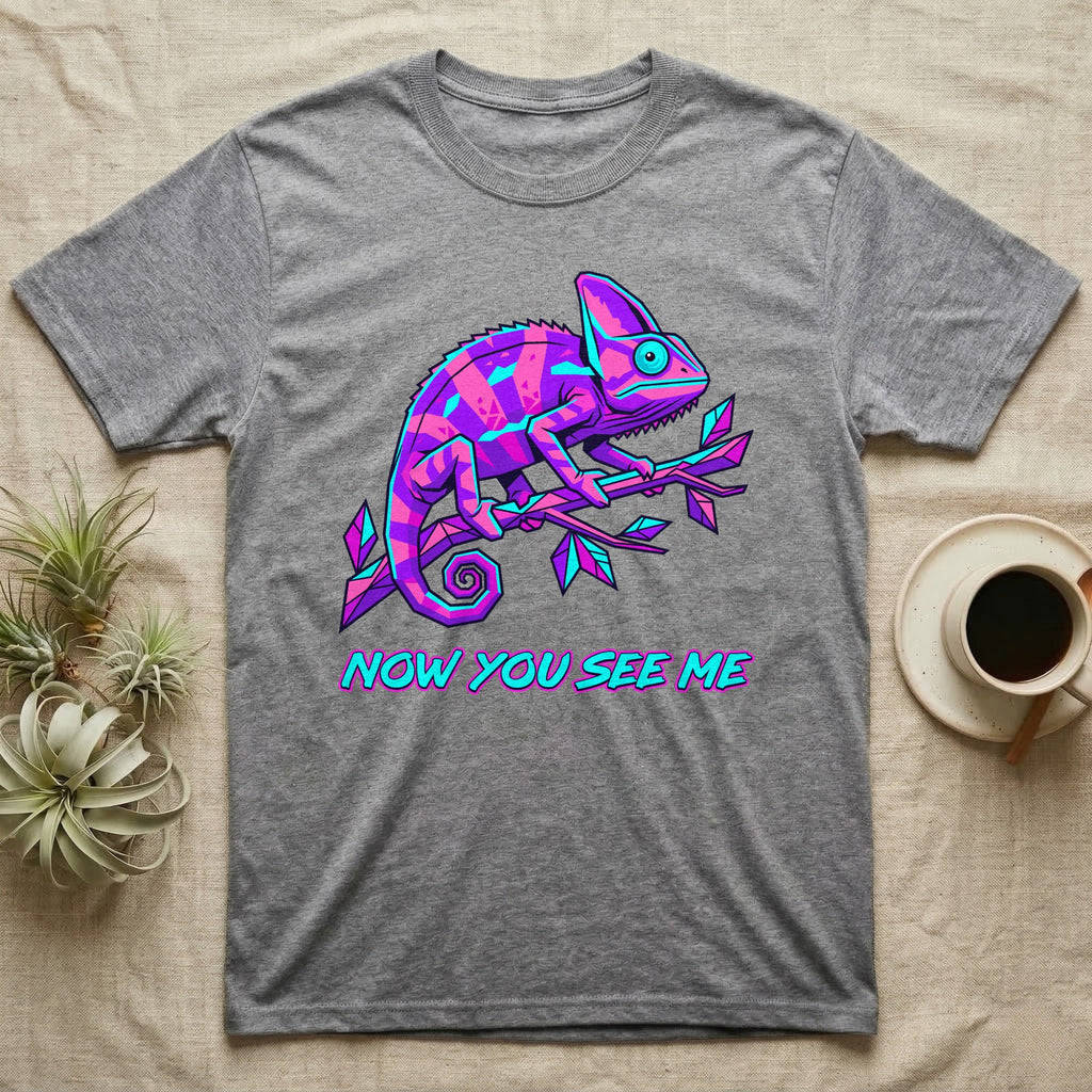 Grey t-shirt with neon purple and blue chameleon and text "NOW YOU SEE ME".