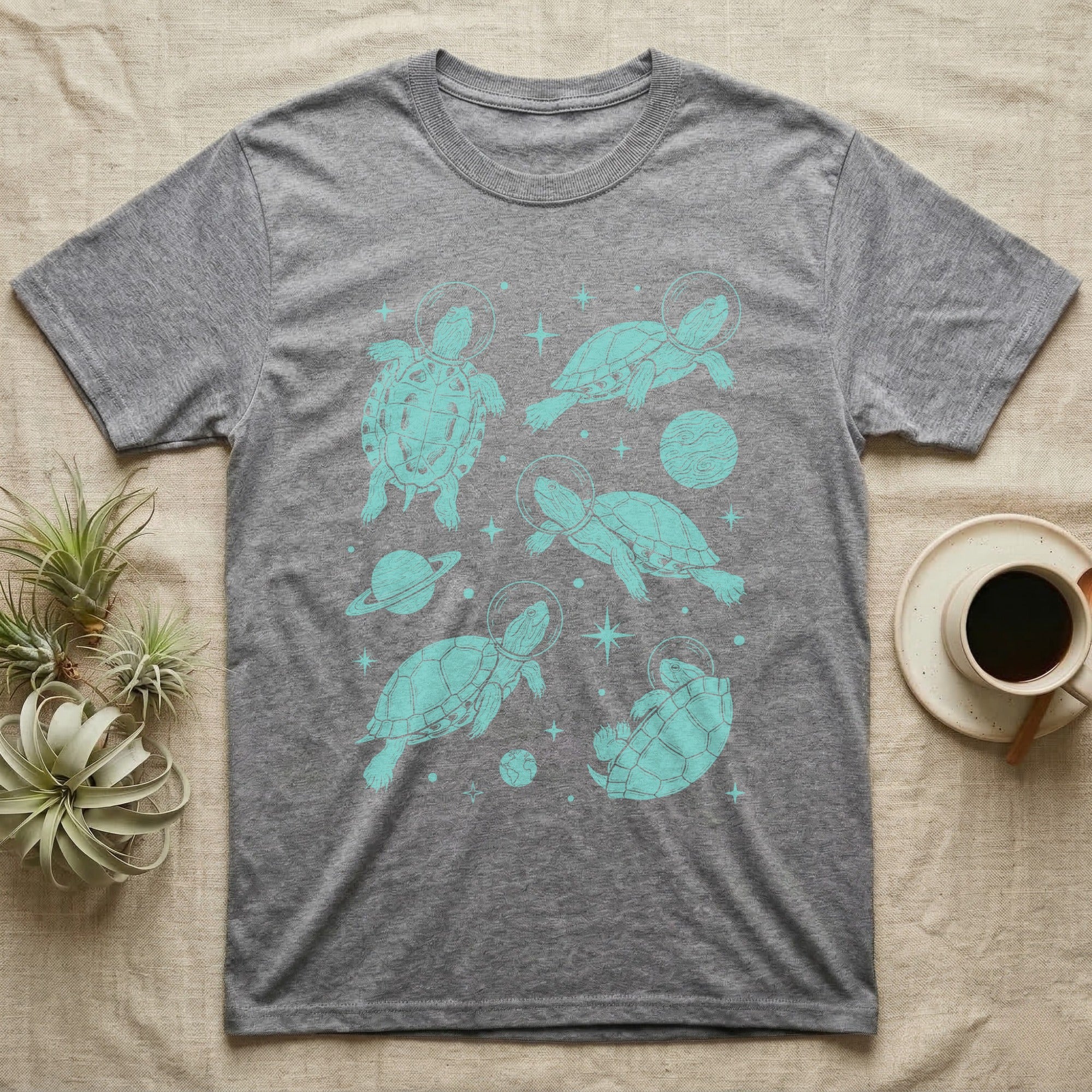 Red Eared Slider Cosmic T-Shirt in Sport Grey — Vintage screen-print illustration of red-eared slider turtles in astronaut helmets floating in space, cosmic teal monochromatic on dark background.