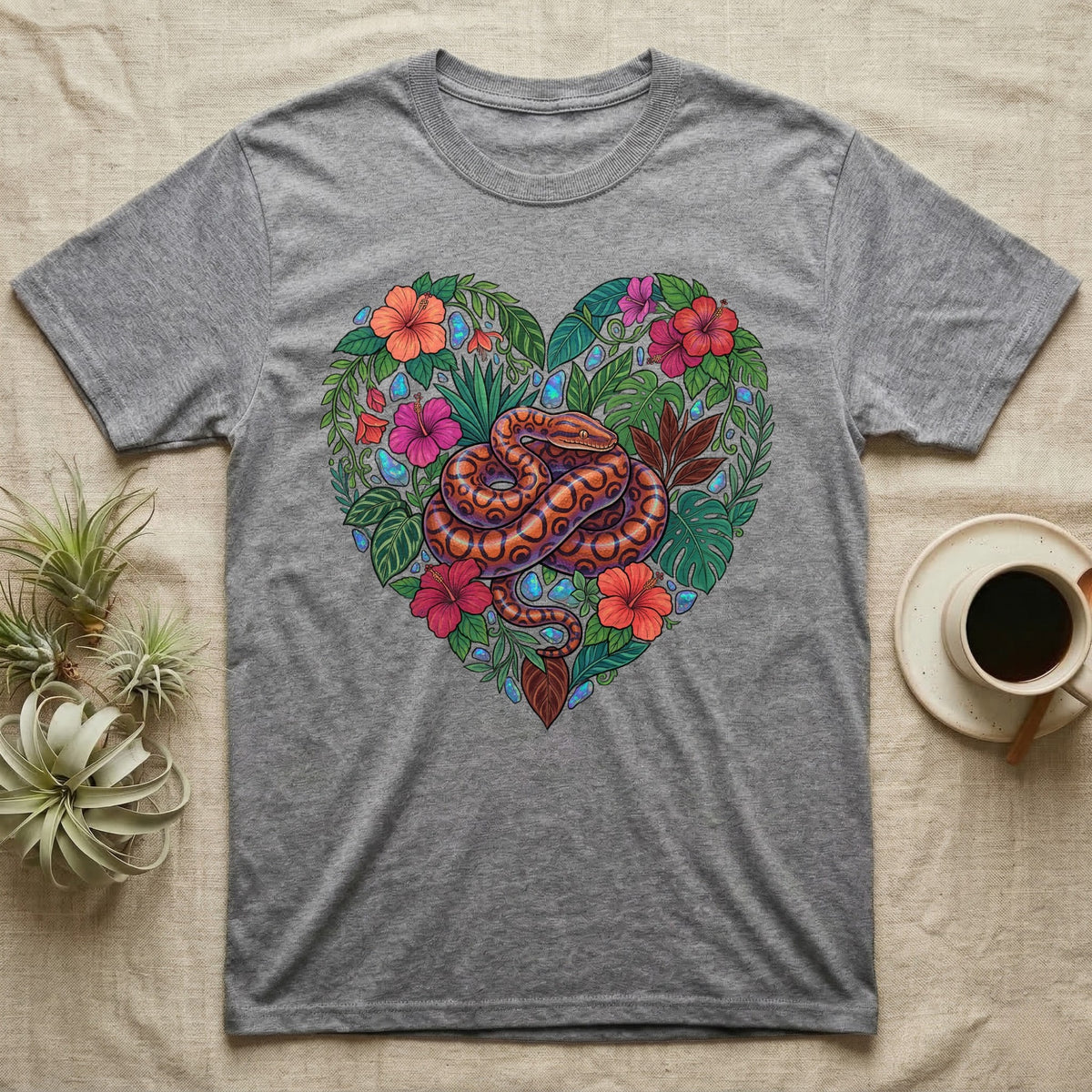 Grey t-shirt featuring a colorful snake within a heart-shaped floral design.