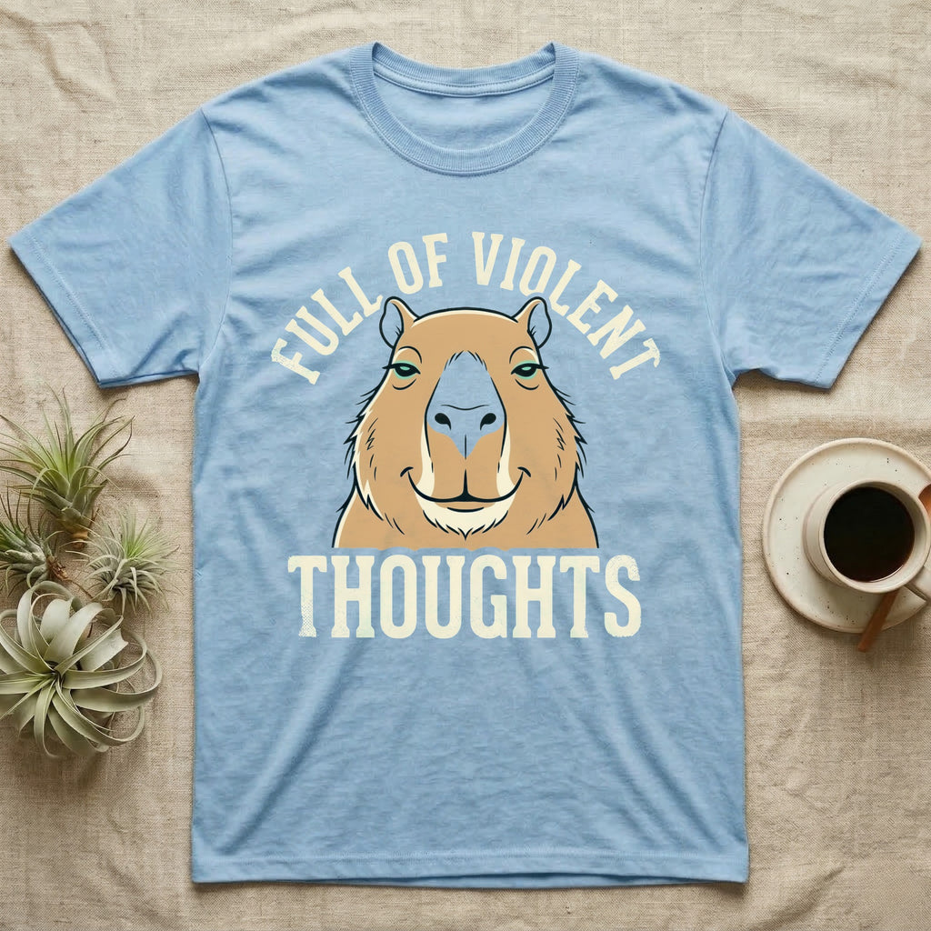 Capybara Violent Thoughts Tee in Light Blue — Vector-bold portrait of a serenely half-smiling capybara framed by cream slab typography reading "Full Of Violent Thoughts."