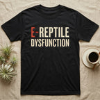 E-Reptile Dysfunction Gecko T-Shirt in Black — Retro-pharmacy typographic wordmark reading "E-Reptile Dysfunction" in distressed cream and tomato-red lettering.