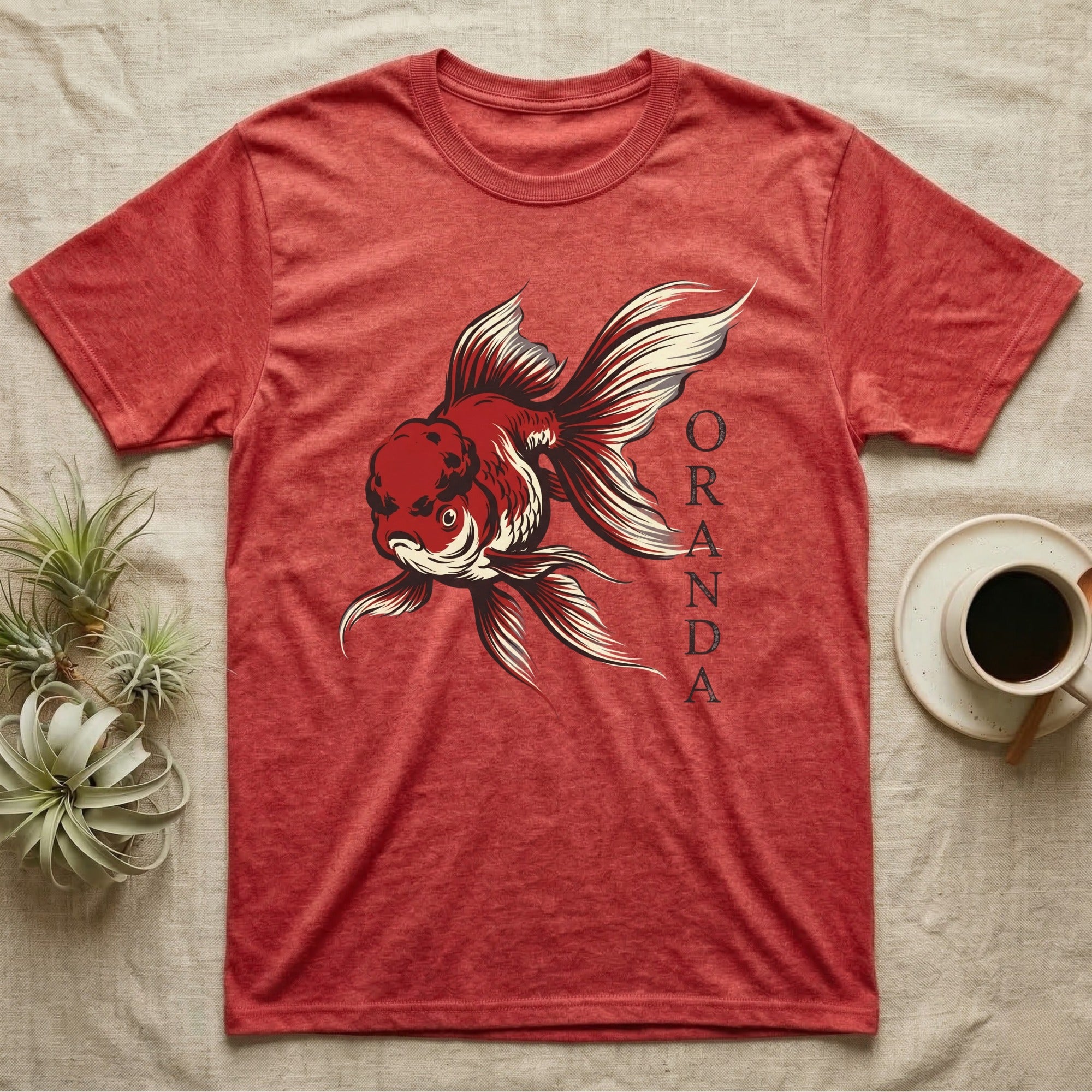 Red t-shirt with a black and white Oranda goldfish graphic.