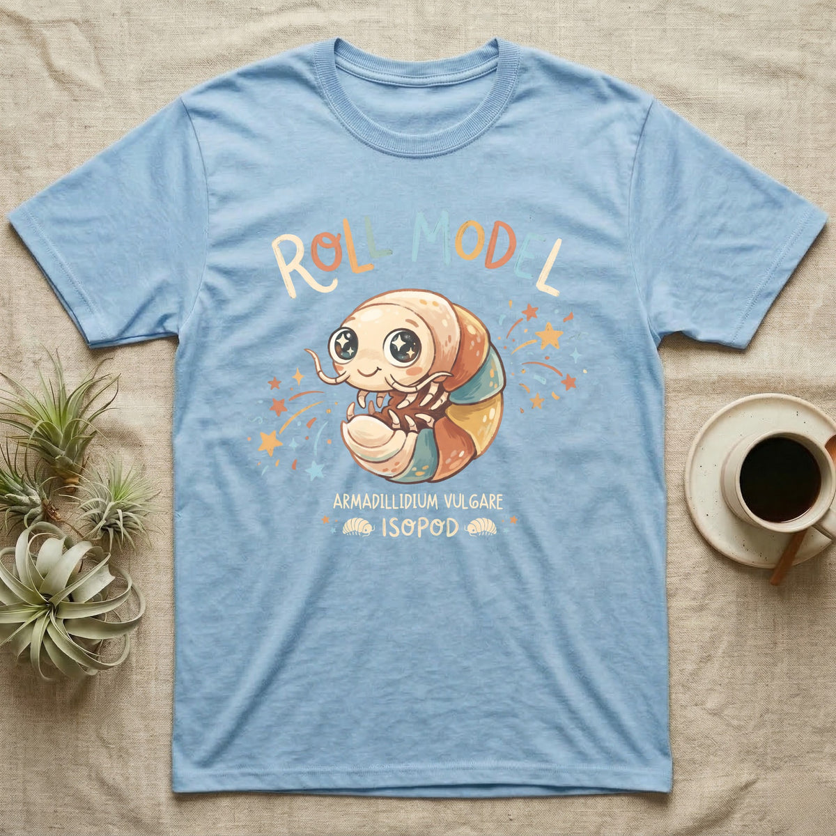 Roly Poly Isopod Roll Model T-Shirt in Light Blue — Storybook roly poly curled into a roll with starry eyes and confetti under hand-lettered "Roll Model".