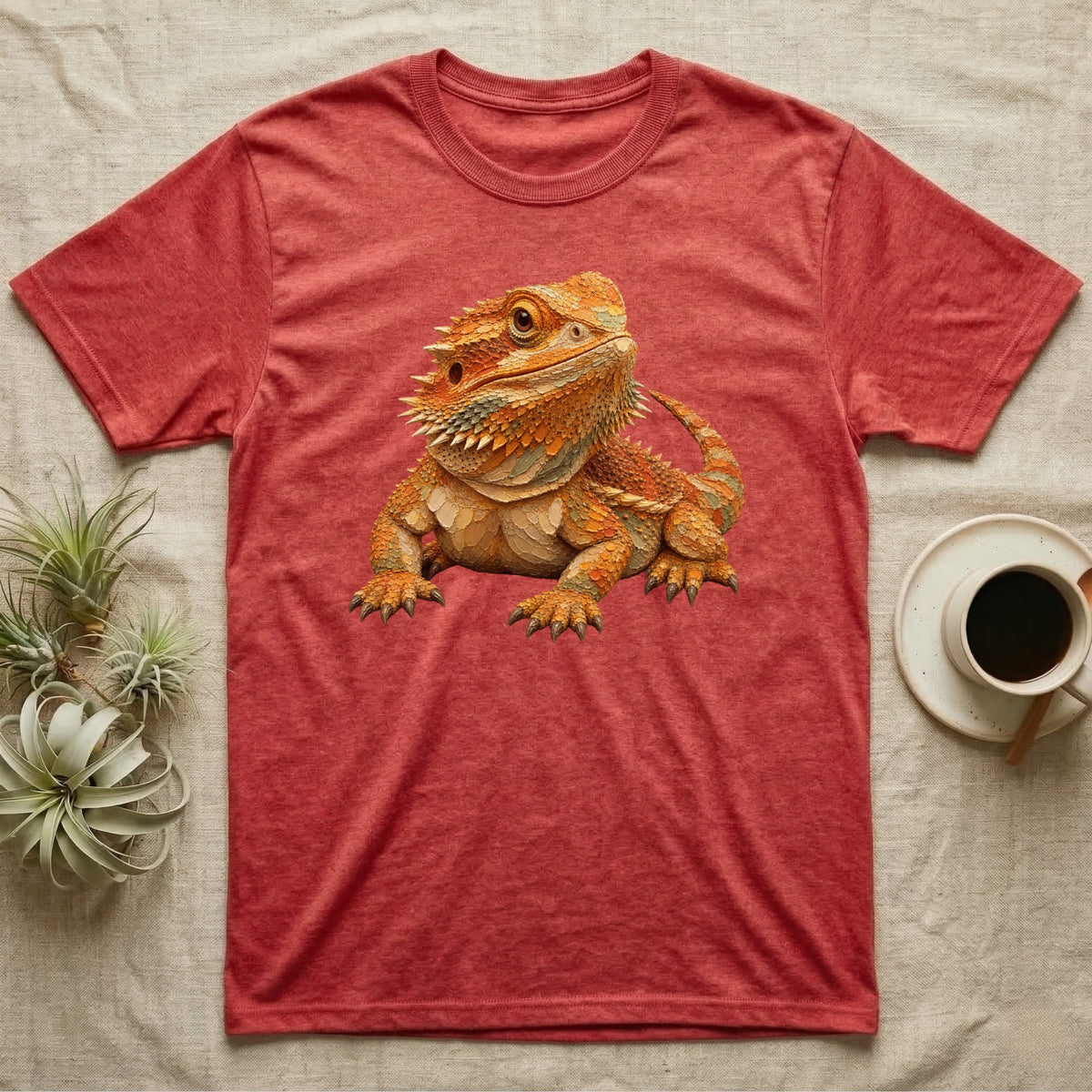 Red heathered t-shirt featuring an illustration of a bearded dragon.