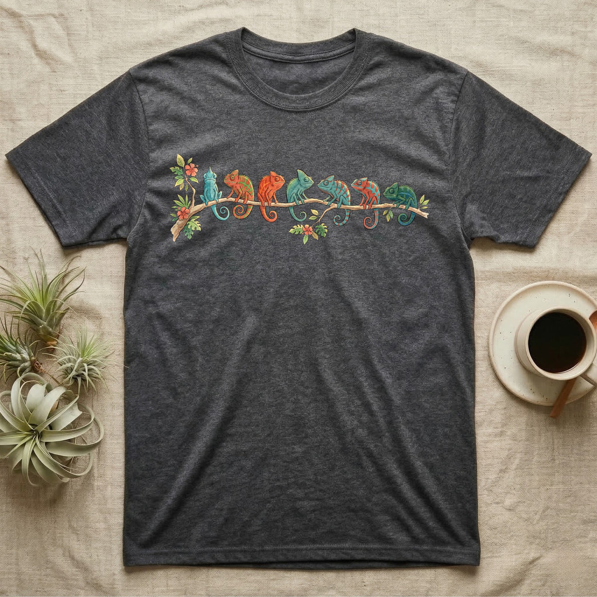 Panther Chameleon Canopy Crew T-Shirt in Dark Heather — Watercolor illustration of seven panther chameleons in Madagascar locale colours on a branch, dark grey T-shirt design.