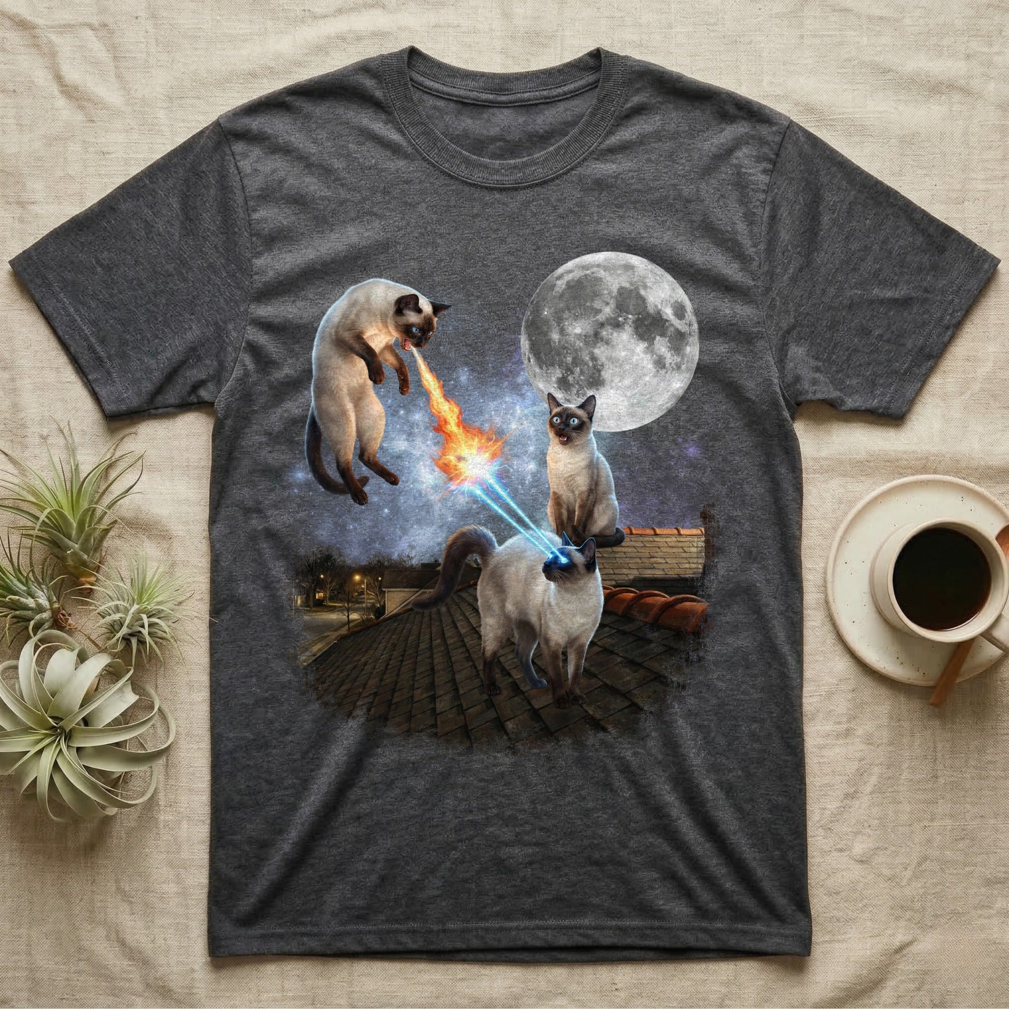 T-shirt features three Siamese cats on a rooftop with a full moon and laser eyes.