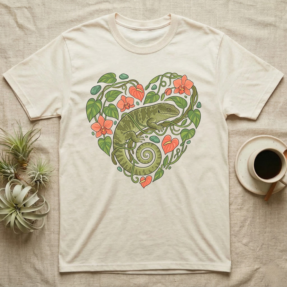 Cream t-shirt with green lizard and floral heart design.