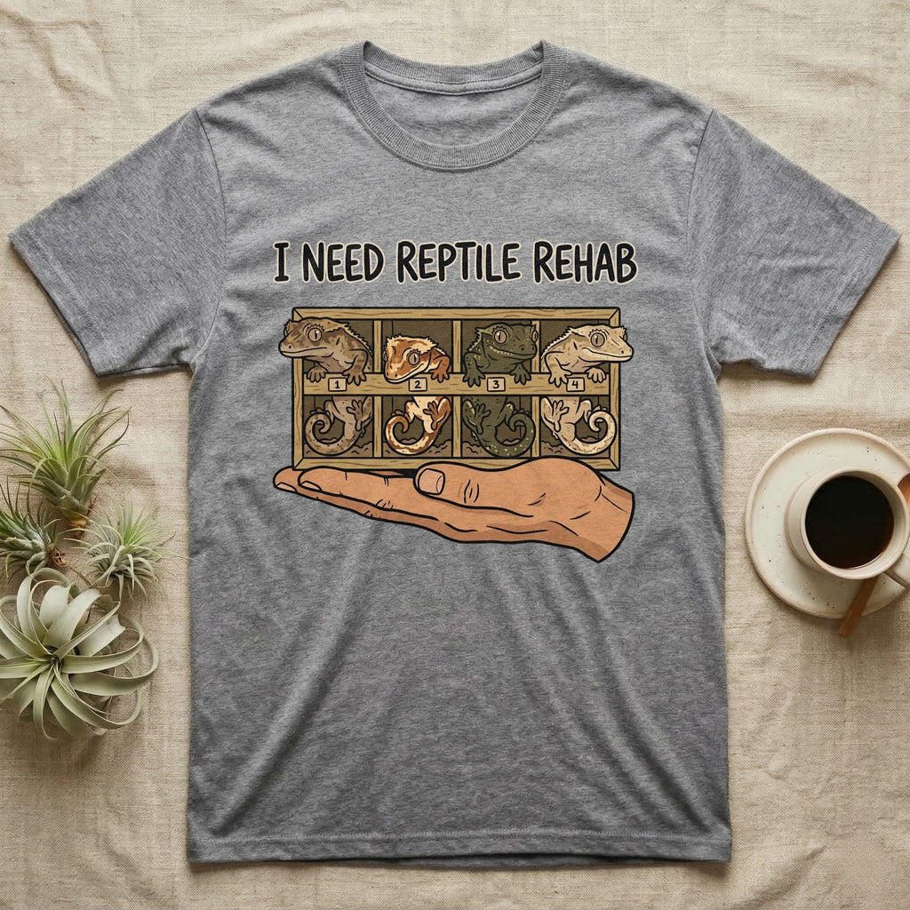 Crested Gecko Rehab T-Shirt in Sport Grey — Vector scene of a hand presenting a rack of four crested geckos under a marker-style reptile rehab caption.