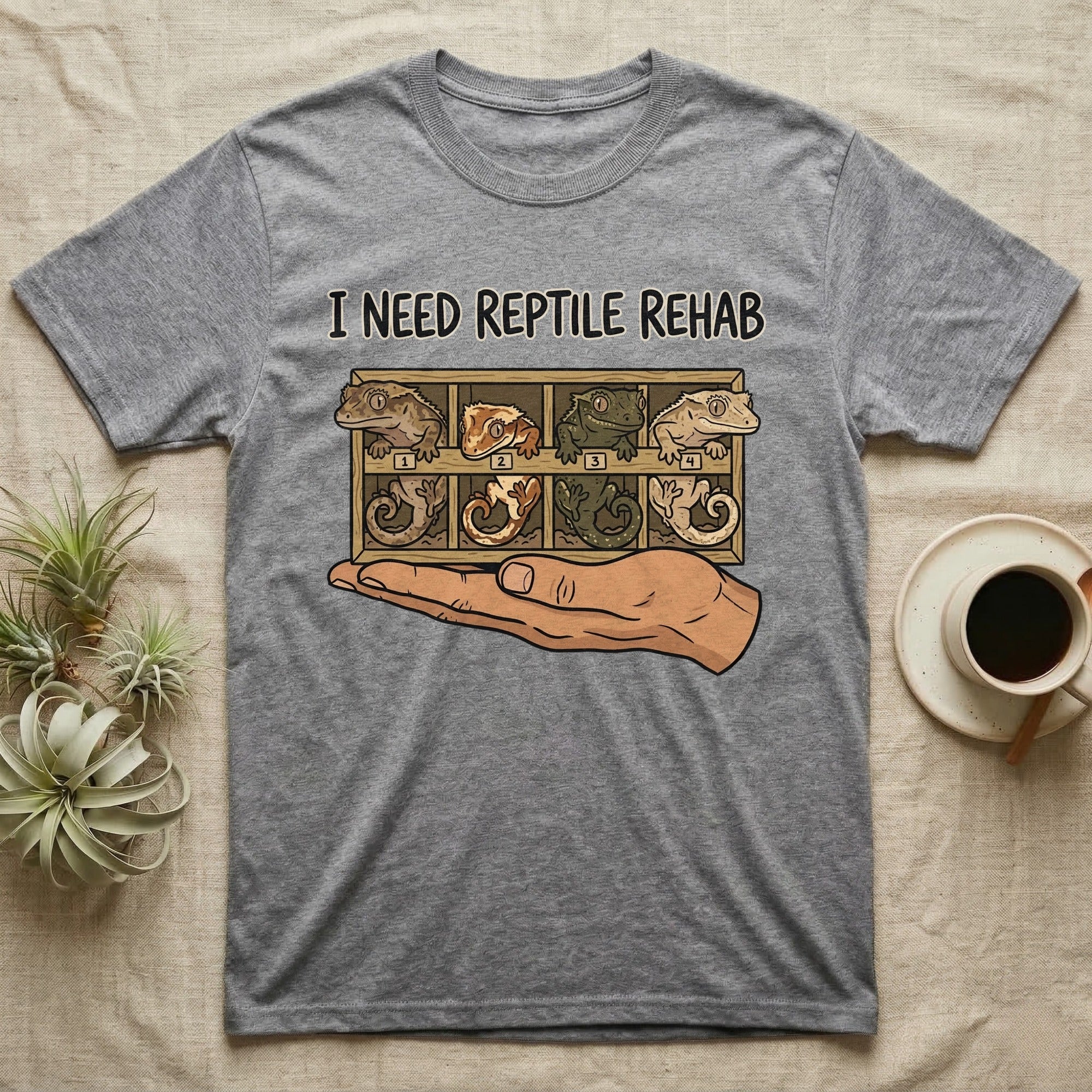 Crested Gecko Rehab T-Shirt in Sport Grey — Vector scene of a hand presenting a rack of four crested geckos under a marker-style reptile rehab caption.
