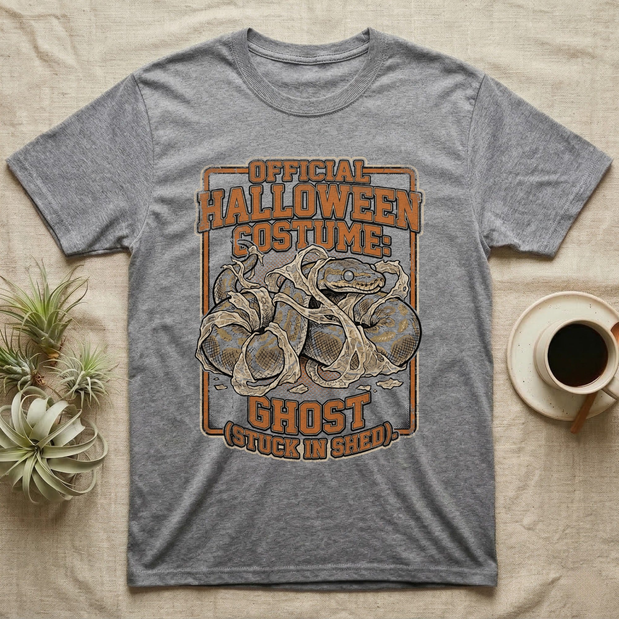 Ball Python Shed Costume T-Shirt in Sport Grey — Distressed framed graphic of a ball python tangled in shed skin, "Official Halloween Costume: Ghost, Stuck in Shed."