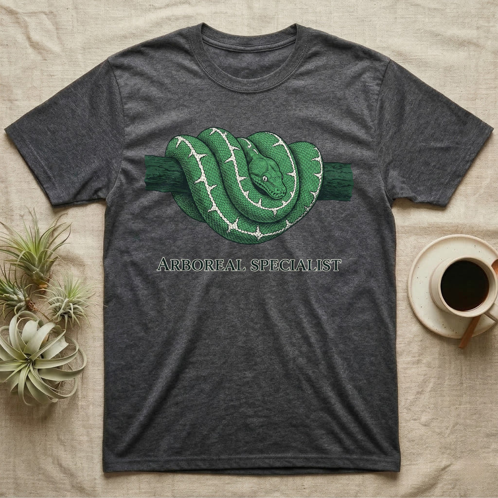Dark grey t-shirt with coiled green snake graphic and "ARBOREAL SPECIALIST" text.