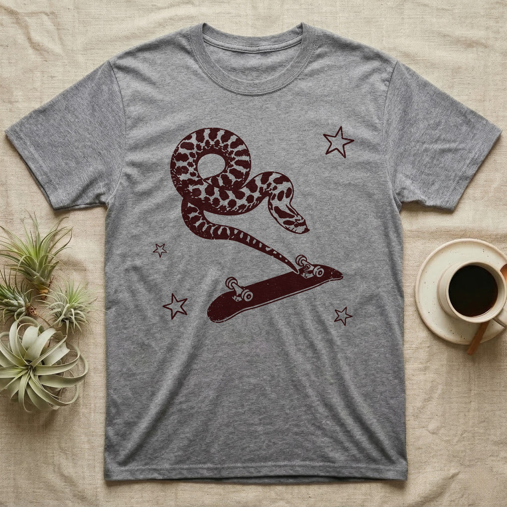 Western Hognose Kickflip T-Shirt in Sport Grey — Distressed one-ink oxblood screenprint of a western hognose snake airborne, tail snapped straight into a skateboard caught upside down mid-kickflip.