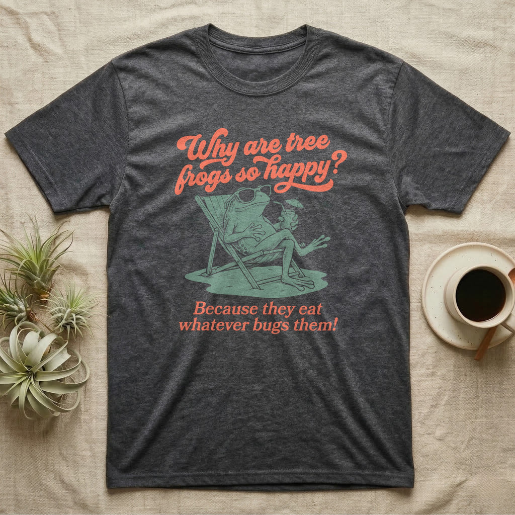 Green Tree Frog Sun Chair T-Shirt in Dark Heather — Illustrated green tree frog reclining on a beach chair with sunglasses and a cocktail, coral script asking why tree frogs are so happy because they eat whatever bugs them.