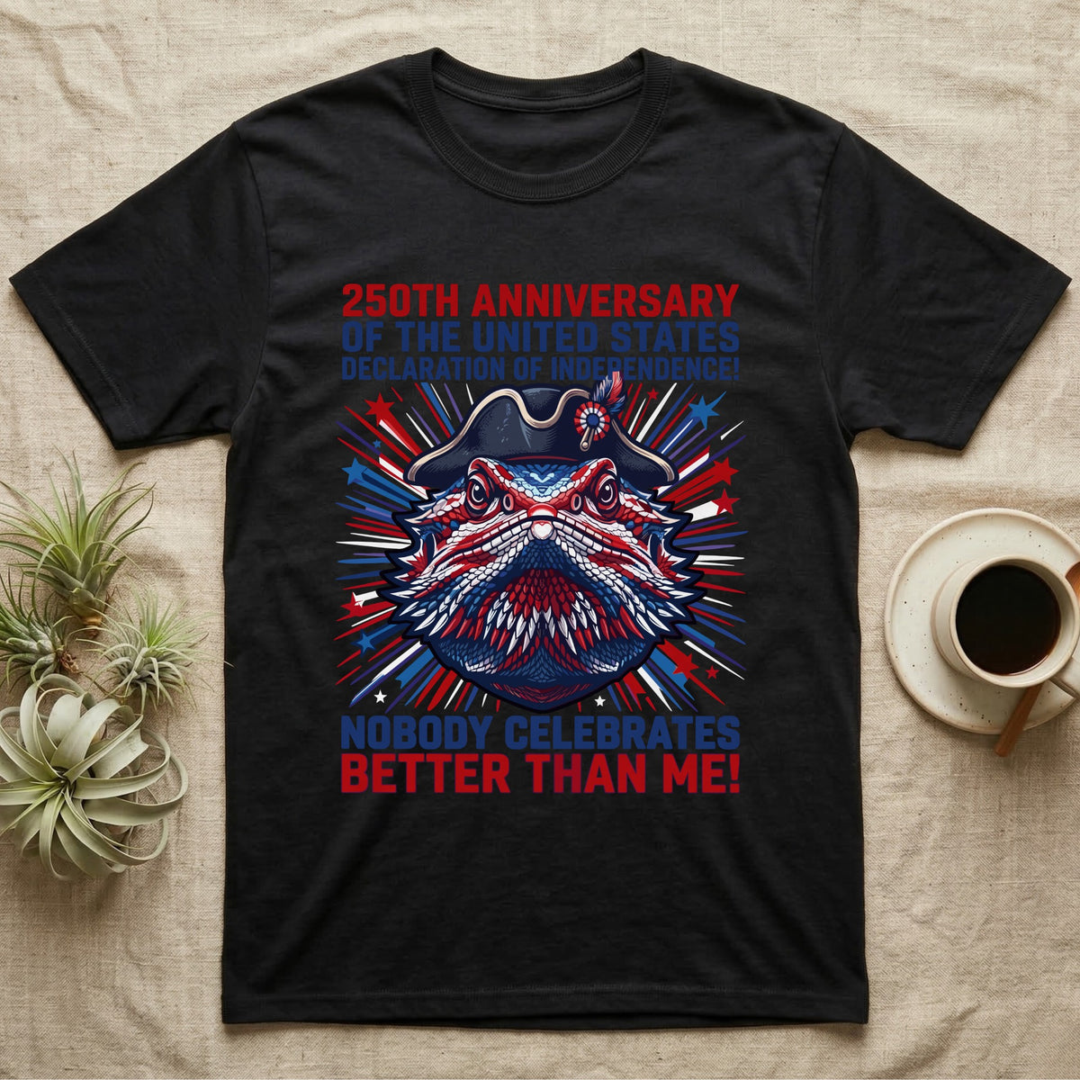 Bearded Dragon Fireworks T-Shirt in Black — Pop-art bearded dragon head in a tricorn hat amid red-white-blue fireworks under Nobody Celebrates Better Than Me.