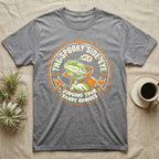 Bearded Dragon Spooky Side-Eye T-Shirt in Sport Grey — Distressed badge of a caped bearded dragon giving side-eye, "The Spooky Side-Eye, Judging Your Candy Choices."