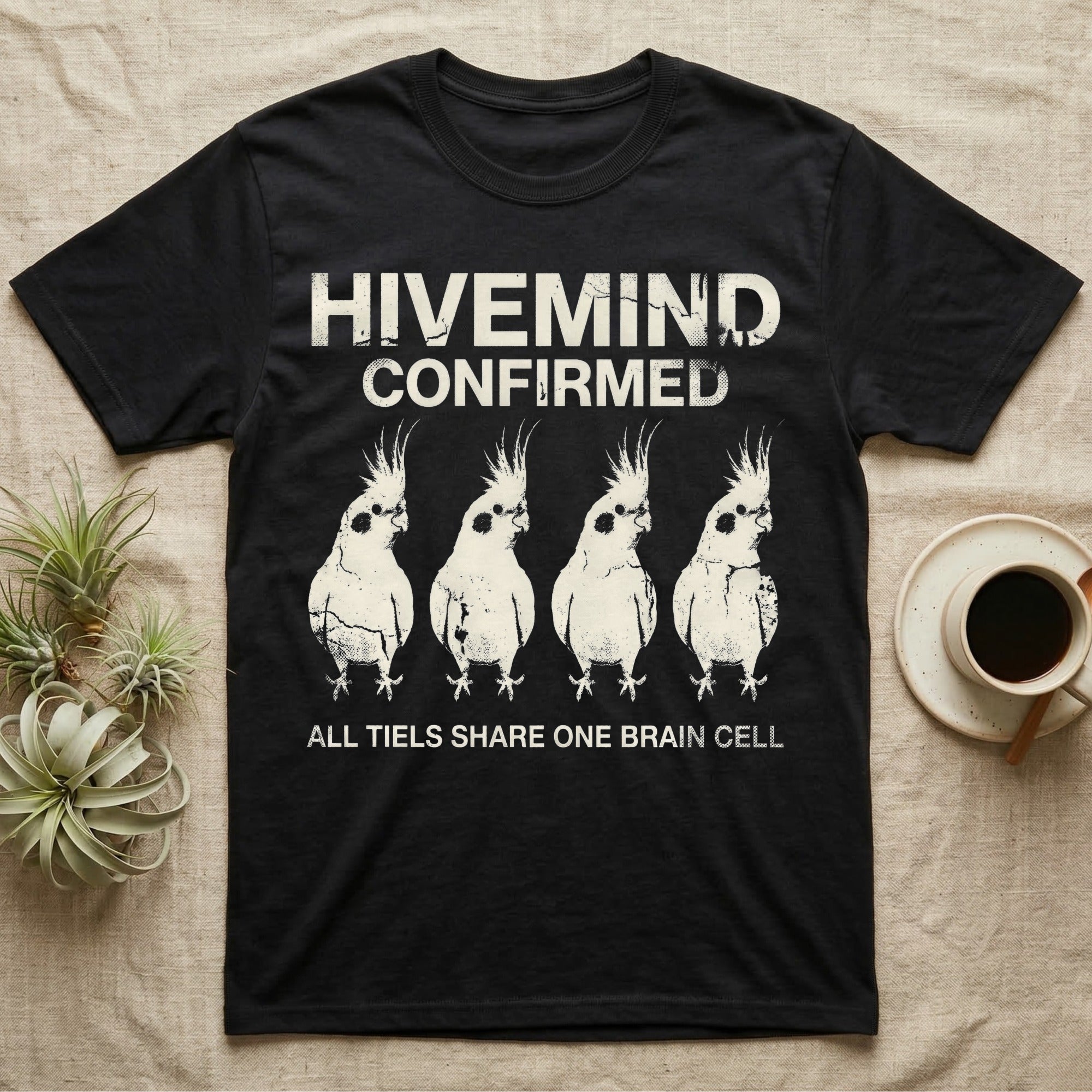 Cockatiel Hivemind Confirmed T-Shirt in Black — Grunge-distressed four cockatiels in identical synchronised posture with distressed type "Hivemind Confirmed."