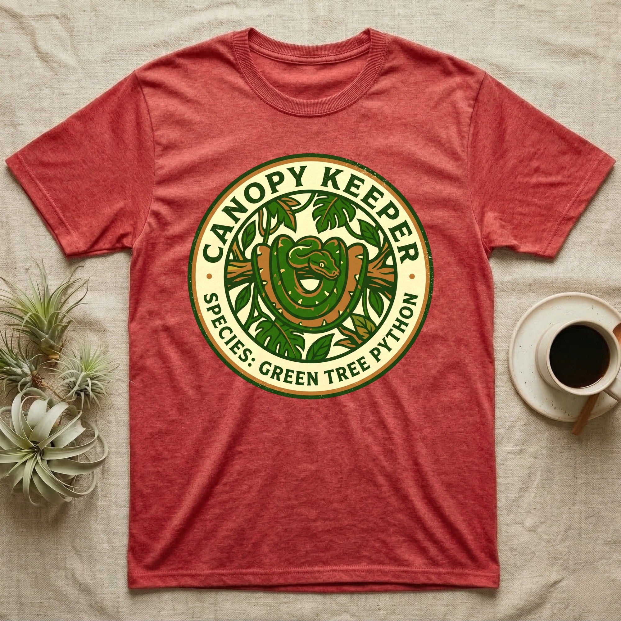 Red t-shirt with green tree python in circular logo.