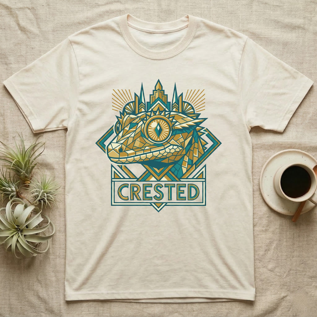 Cream t-shirt with geometric gecko design and "CRESTED" text.
