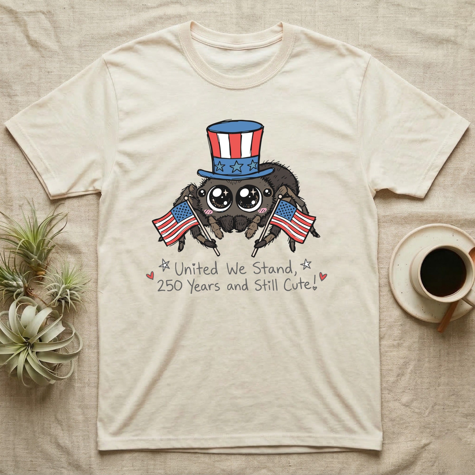 Jumping Spider Cute T-Shirt in Natural — Kawaii jumping spider with big eyes in a top hat waving two flags above script United We Stand, 250 Years and Still Cute.