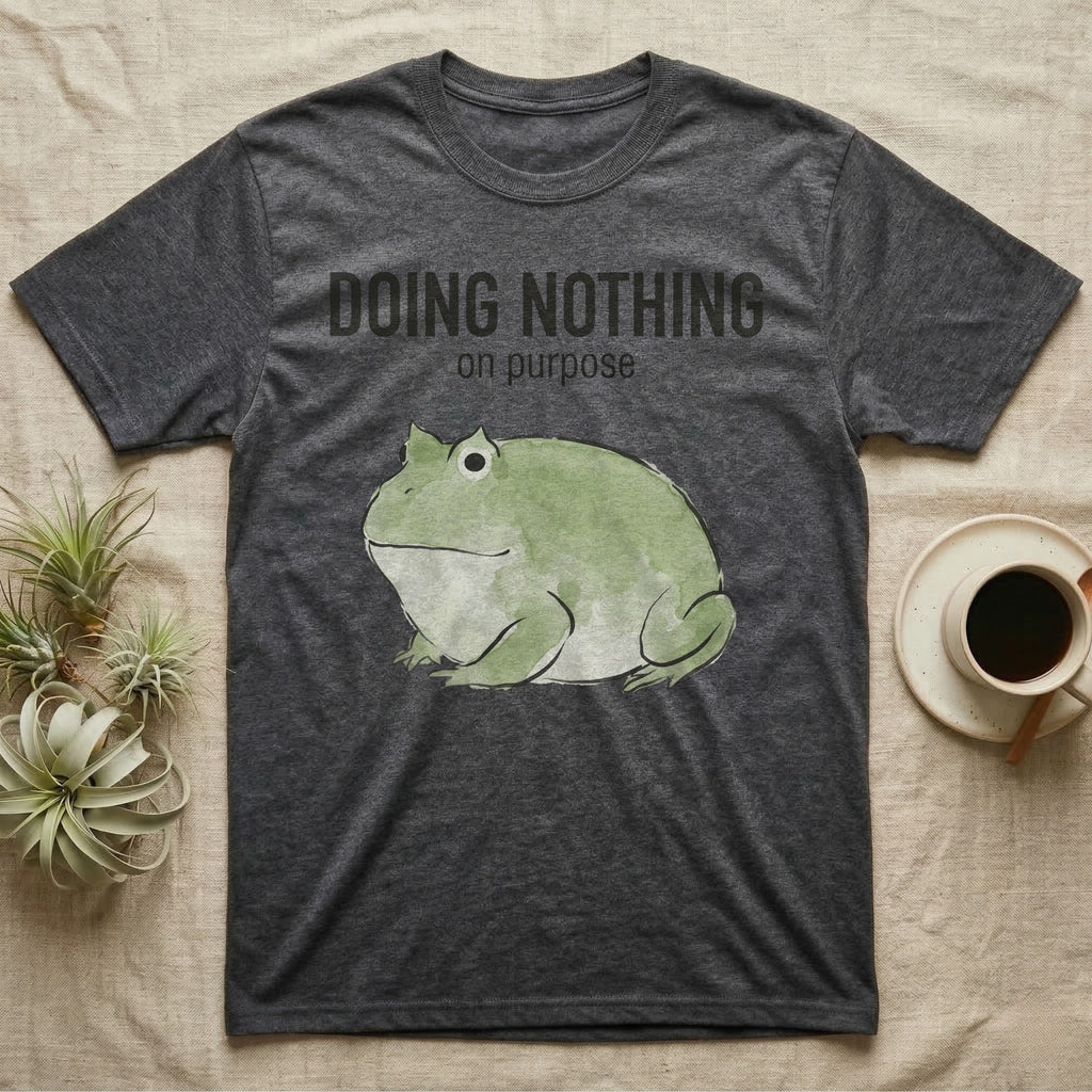 Pacman Frog Doing Nothing T-Shirt in Dark Heather — Watercolour pacman frog blob in profile below the words doing nothing on purpose, on grey