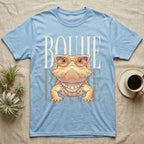 Light blue t-shirt with a bearded dragon wearing sunglasses and jewelry.