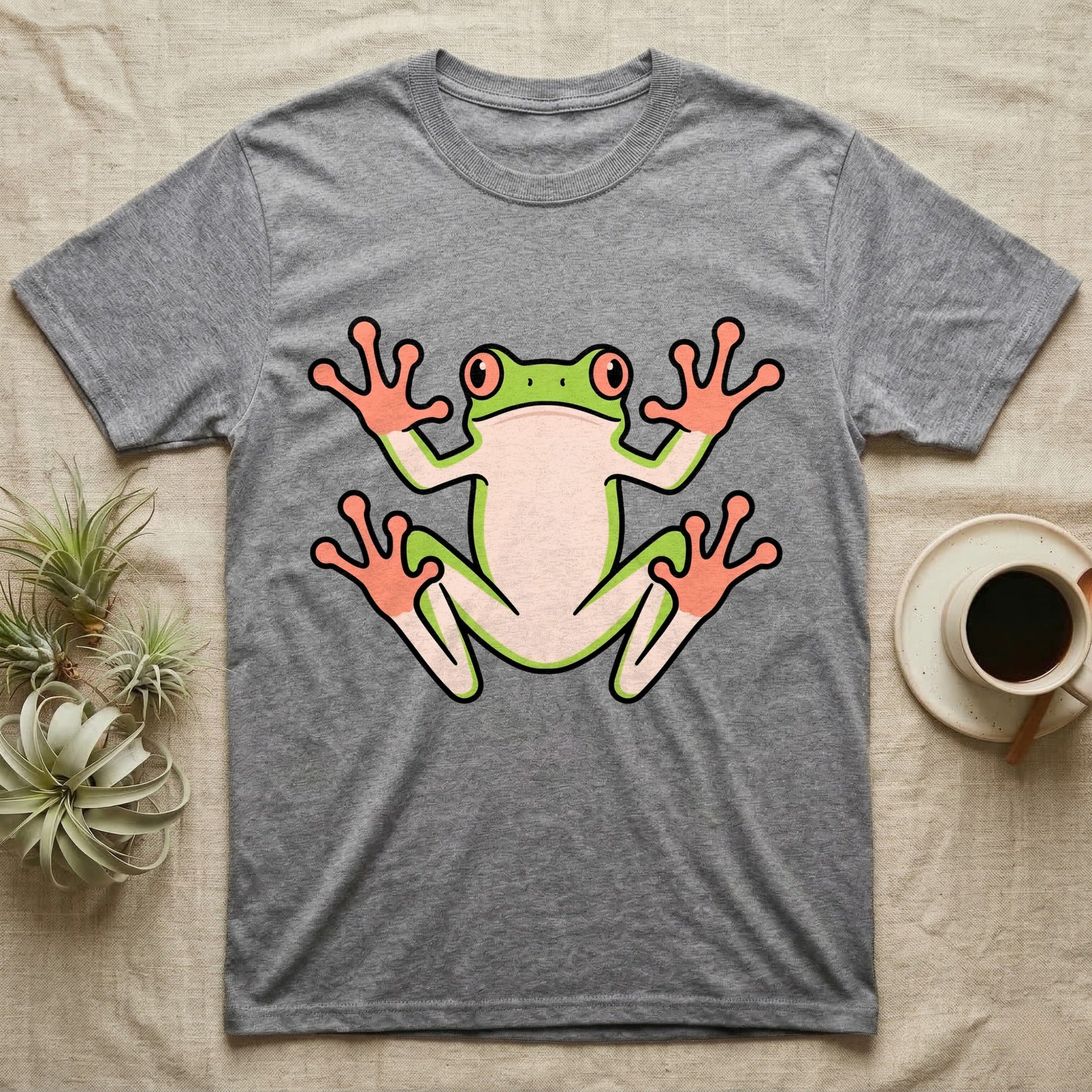 Tree Frog On Glass T-Shirt in Sport Grey — Vector-bold tree frog plastered against implied glass, suction feet splayed wide, small "Tree Frog On Glass." caption.