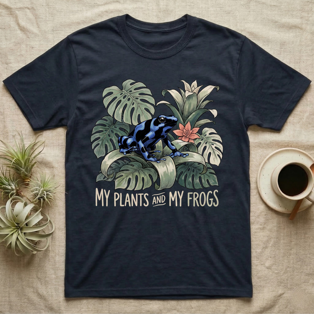 Plants And Frogs T-Shirt in Navy — Naturalist-plate illustration of a dart frog perched in lush foliage with hand-lettered text reading My Plants And My Frogs.