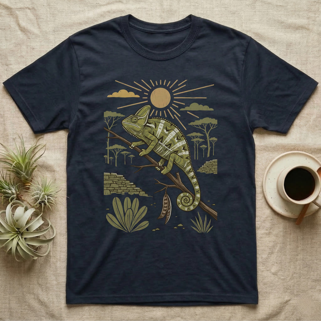 Veiled Chameleon Home Range T-Shirt in Navy — Woodcut-style illustration of a veiled chameleon gripping an acacia branch with terraced walls and umbrella trees behind, no on-shirt text.