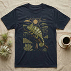 Veiled Chameleon Home Range T-Shirt in Navy — Woodcut-style illustration of a veiled chameleon gripping an acacia branch with terraced walls and umbrella trees behind, no on-shirt text.