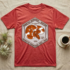 Red t-shirt with hexagonal graphic of a snake and text "Genetic Wonder - Reftail".