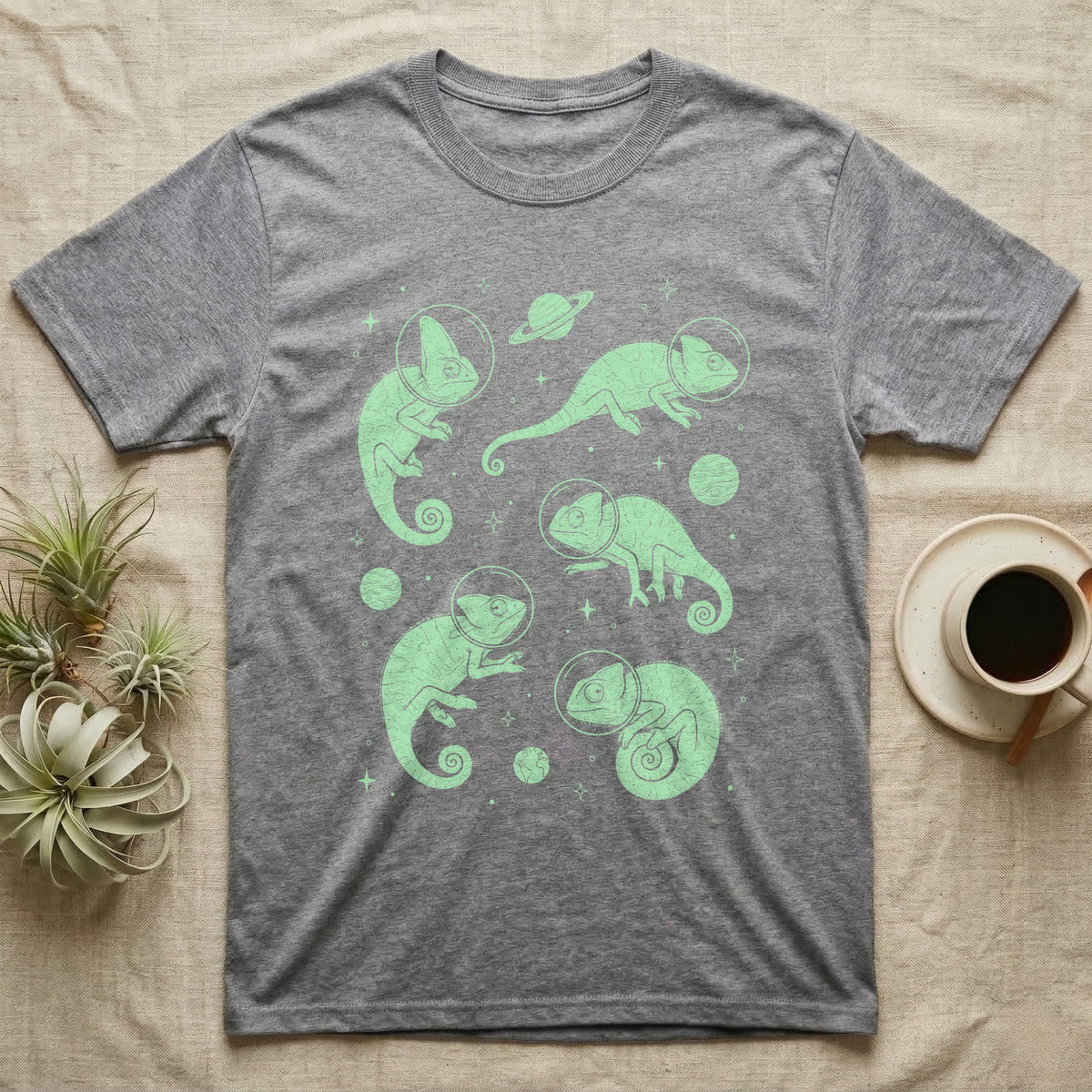 Veiled Chameleon Cosmic T-Shirt in Sport Grey — Vintage screen-print illustration of veiled chameleons in astronaut helmets floating in space, cosmic nebula mint green monochromatic on dark background.